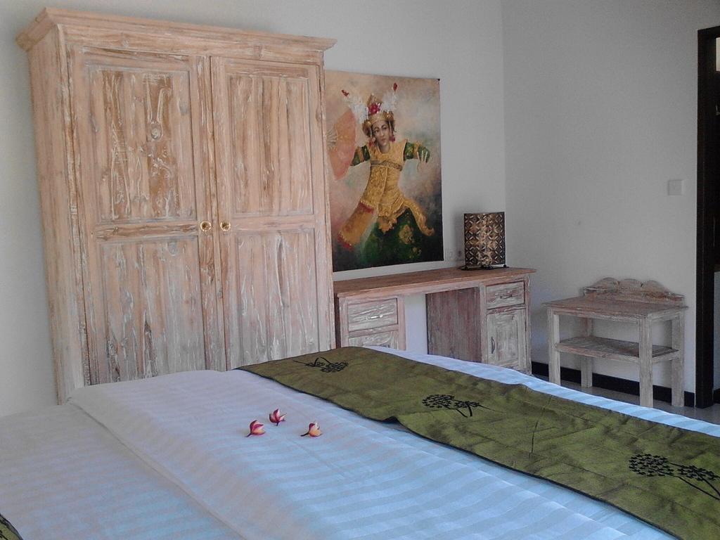 Taman Dewi Sri Villa Et Bungalow เปมูเตรัน ห้อง รูปภาพ